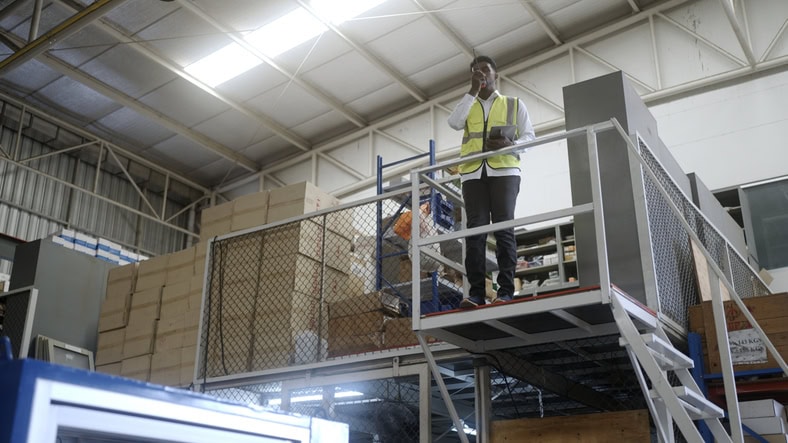 worker standing on mezzanine