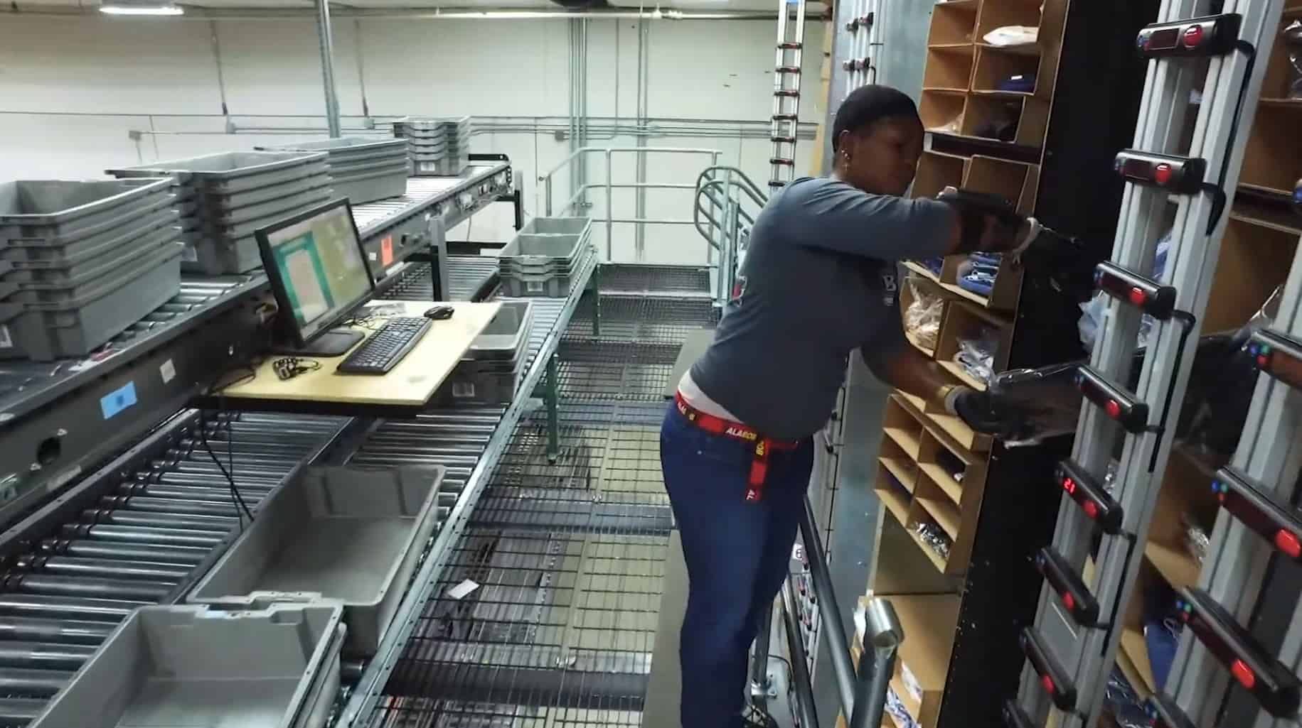 worker using White Systems horizontal carousel