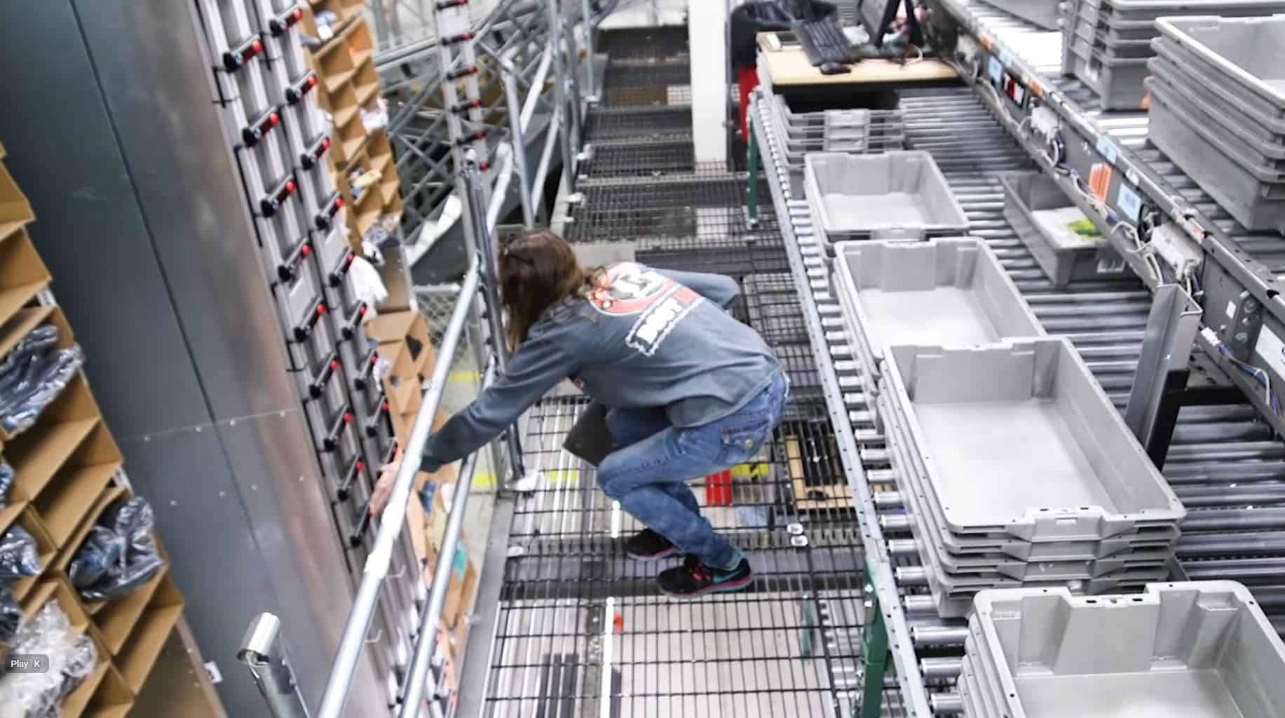 another worker using White Systems horizontal carousels in Boot Barn case study