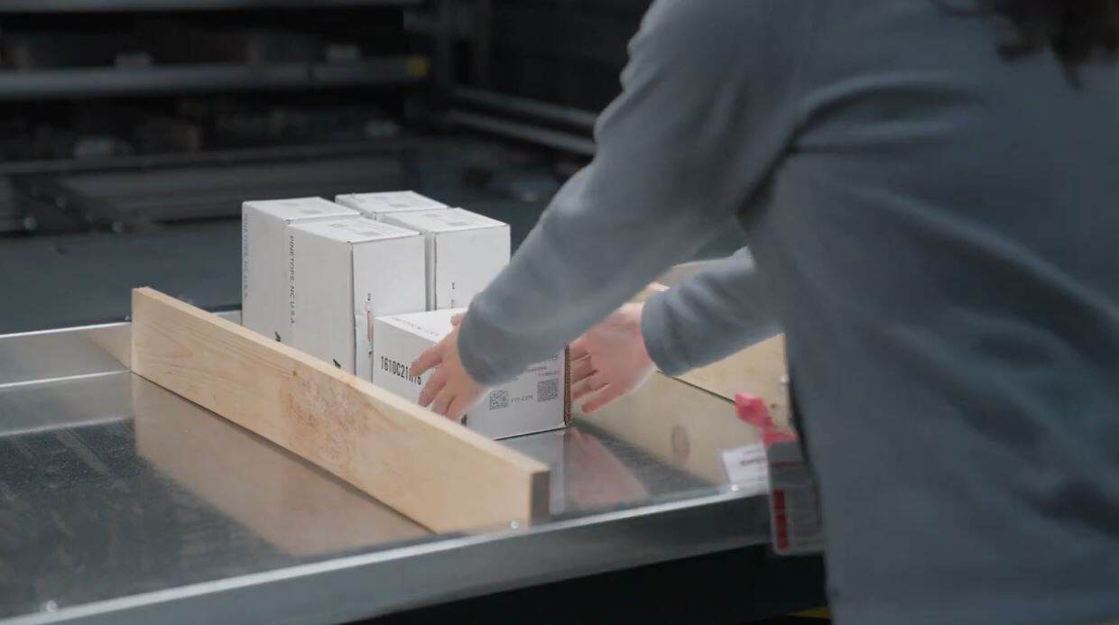 operator using vertical lift module in ABB Case Study from SencorpWhite and White Systems