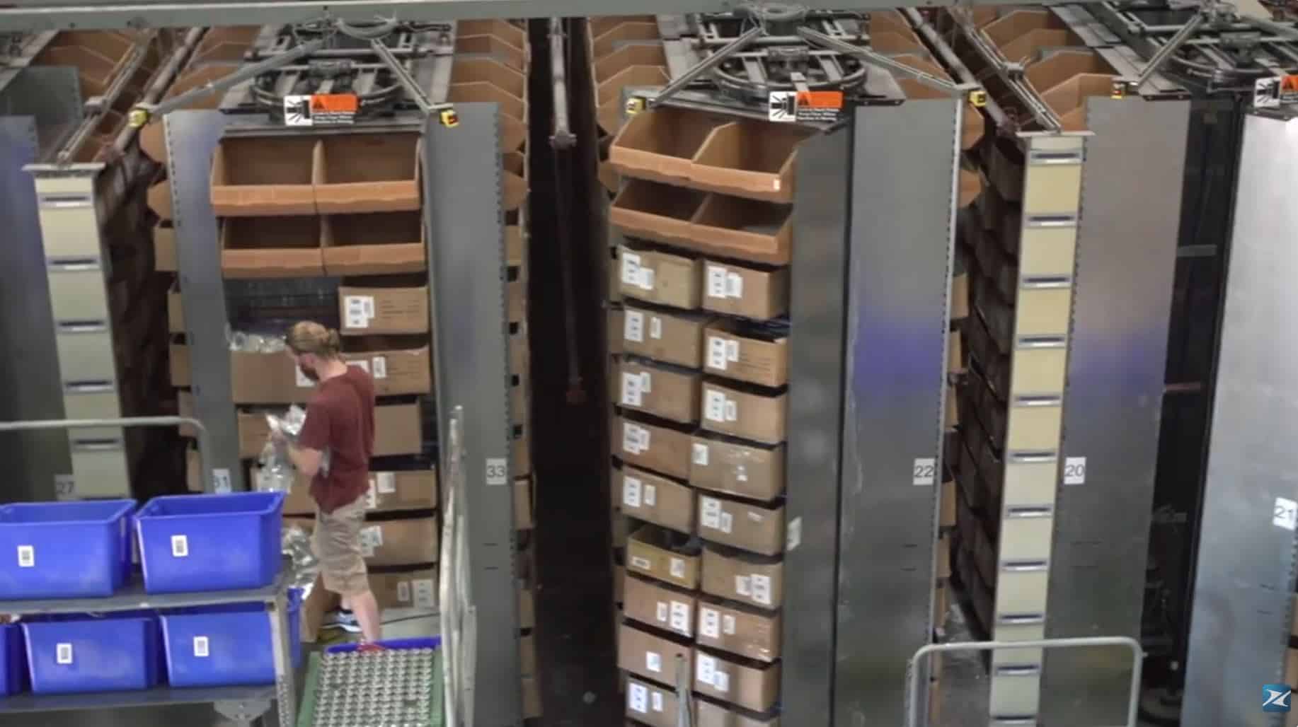 warehouse worker using White Systems horizontal carousel
